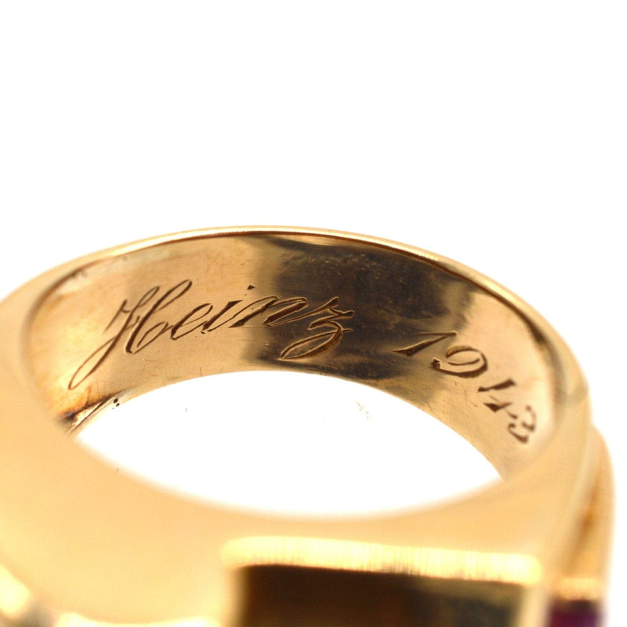 Close-up of the engraved interior of a 1940s French gold and platinum ring with the name Heinz and date 1943.