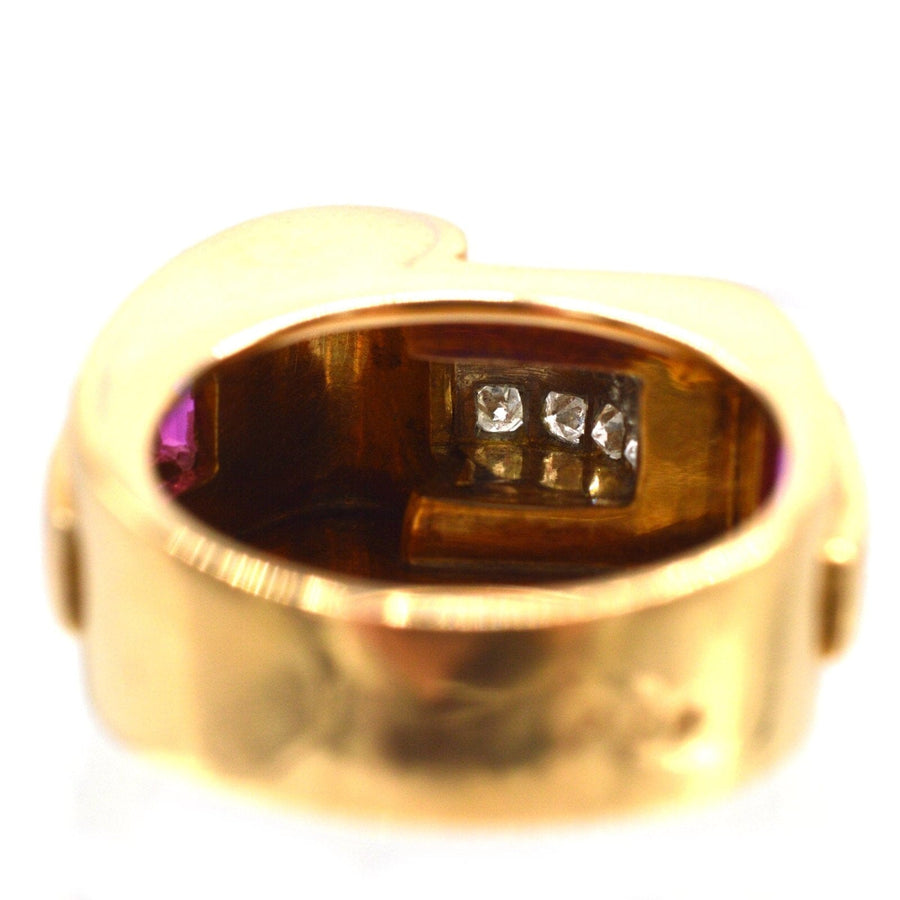 Interior view of a vintage French 1940s gold and platinum ring featuring diamonds and rubies, engraved inside.