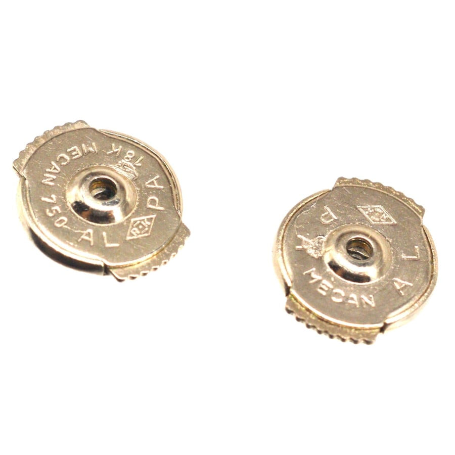 18kt gold bullet casing earrings with engraved details, showcasing unique design and craftsmanship.