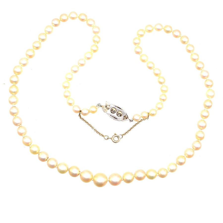 French Belle Epoque 18ct white gold cultured pearl necklace with elegant diamond clasp, timeless jewelry piece.
