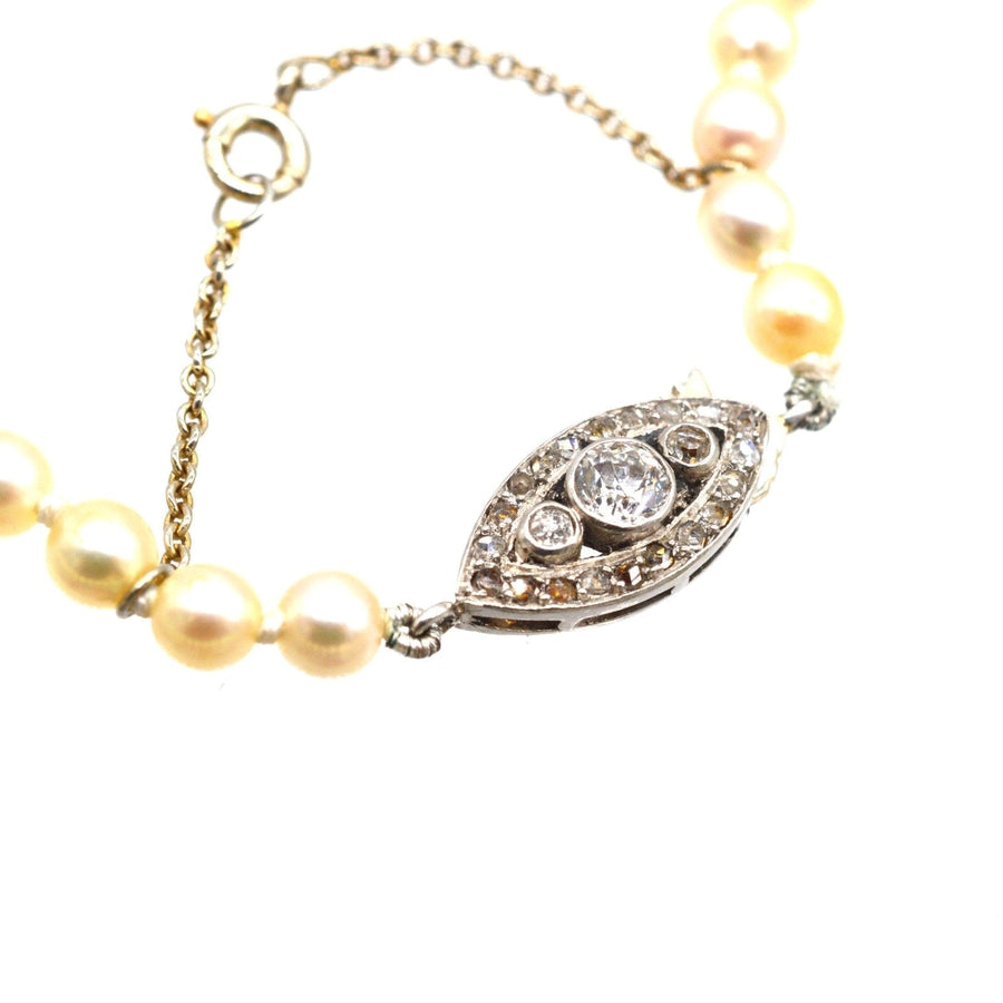 Elegant 18ct white gold cultured pearl necklace with stunning diamond clasp, vintage design from the French Belle Epoque era.