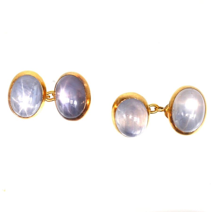 Early 20th century 18ct gold star sapphire cufflinks showcasing stunning asterism effect.
