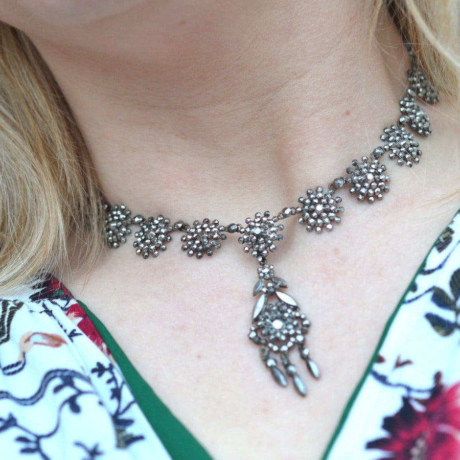 Georgian 19th century cut steel necklace featuring floral design, showcasing intricate craftsmanship and vintage elegance.