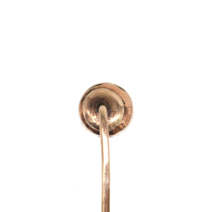 Close-up view of a Georgian 9ct gold tie pin featuring a polished finish and integrated stopper.