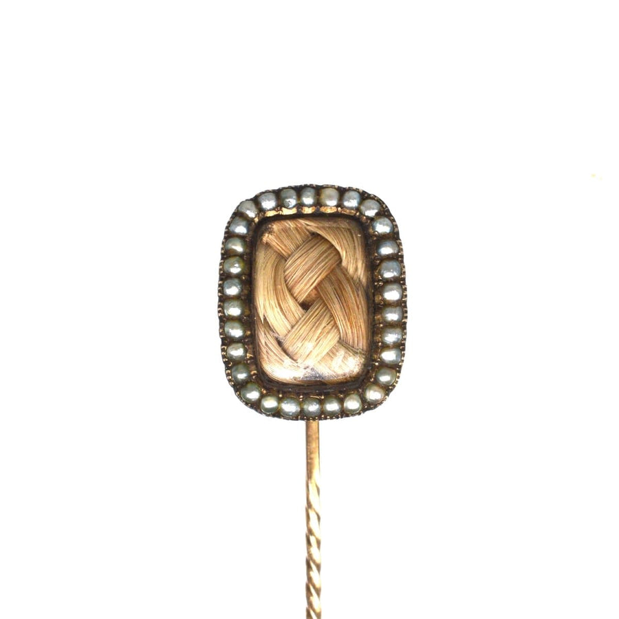 Georgian 9ct gold mourning tie pin with seed pearls and woven hair, showcasing exquisite craftsmanship.