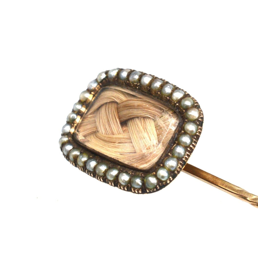 Georgian 9ct gold mourning tie pin with woven hair and seed pearls, showcasing vintage craftsmanship.