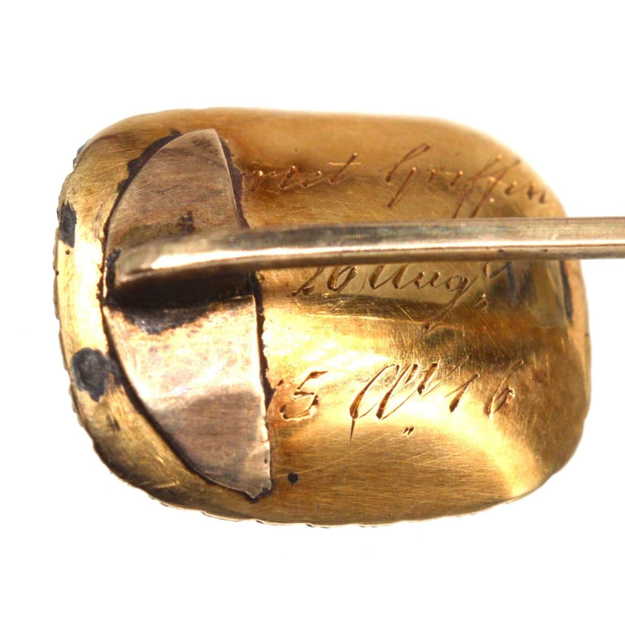 Close-up of a Georgian 9ct gold mourning tie pin engraved with 'Harriet Griffin Obt. August 26th 1815'.