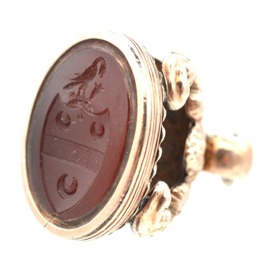 Georgian 9ct gold armorial seal ring featuring three crescent moons and Lee family crest with eagle's leg.
