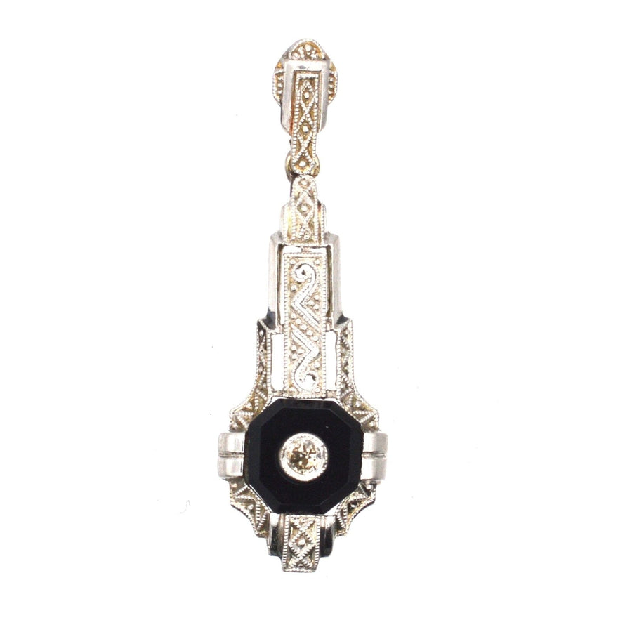 German Art Deco pendant in 18ct white gold with onyx and diamond center, featuring intricate engraving.