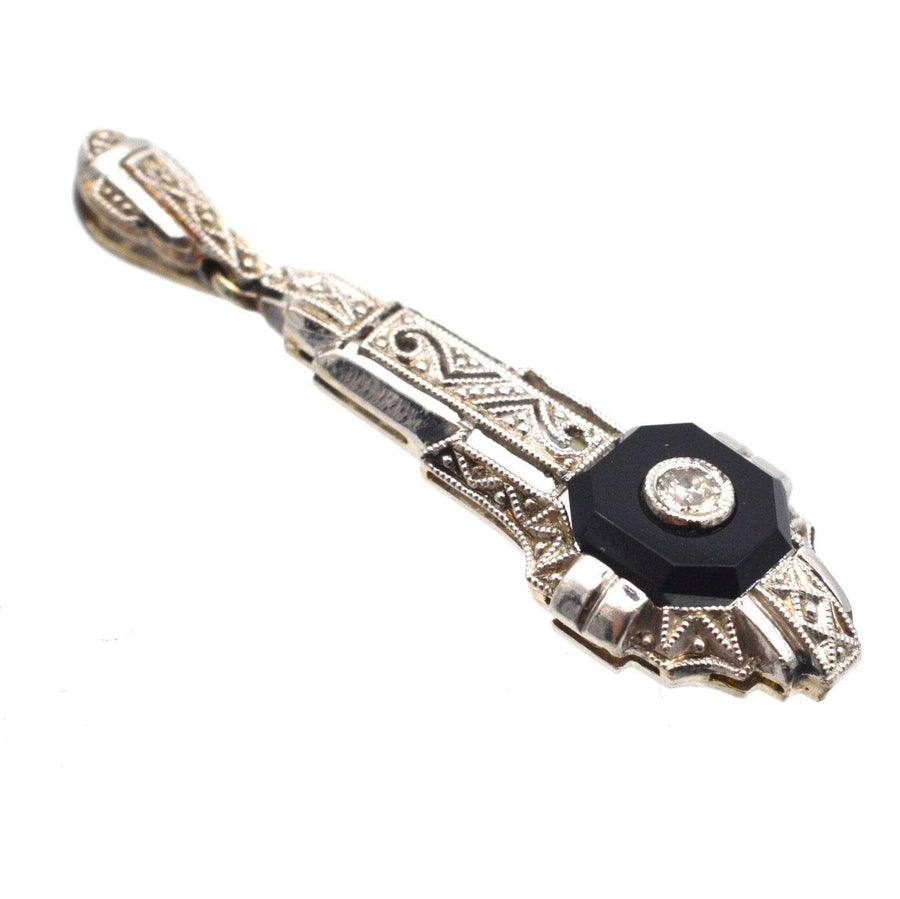 German Art Deco 18ct white gold pendant featuring an onyx plaque and diamond centerpiece with intricate engraving.