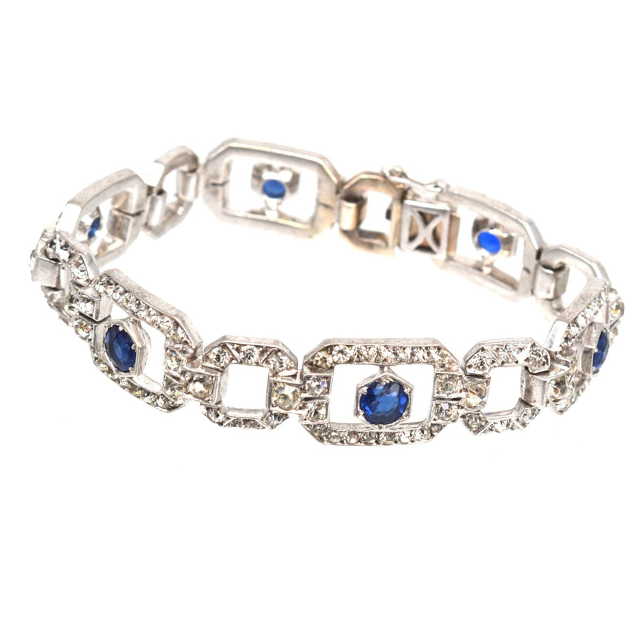 Art Deco silver bracelet by Knoll & Pregizer featuring blue 'sapphire' and white paste stones, elegant vintage jewelry.