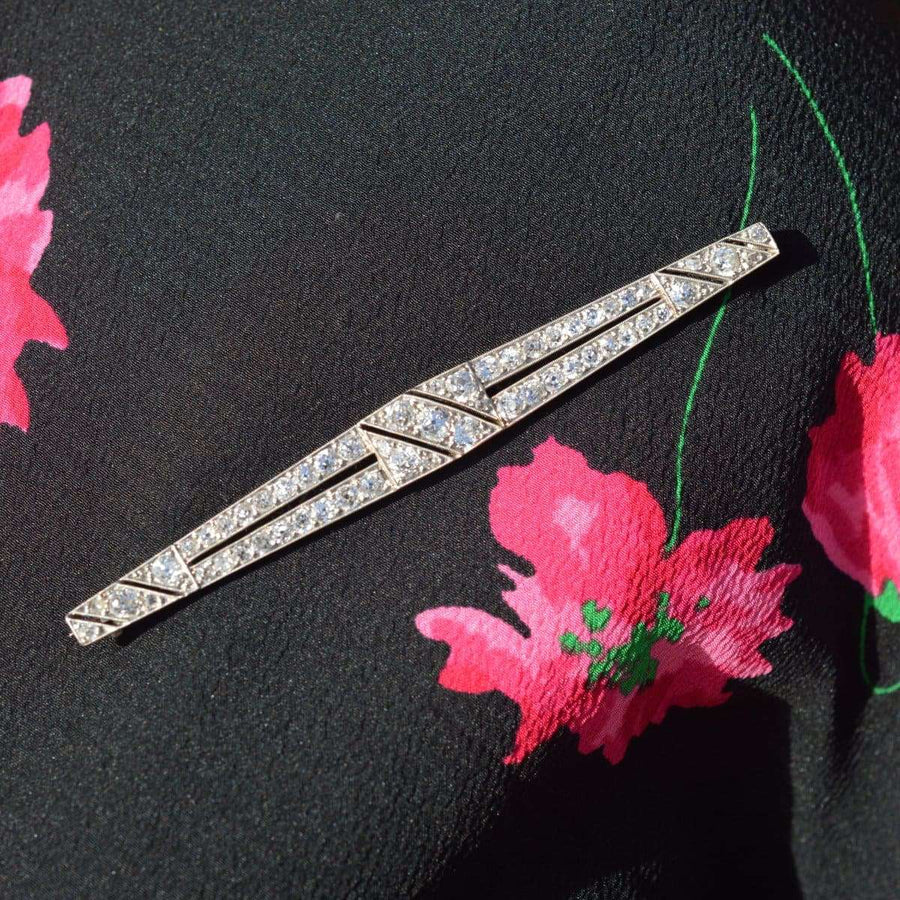 Large Art Deco platinum brooch featuring intricate diamond setting and aeronautical design, perfect for vintage fashion.