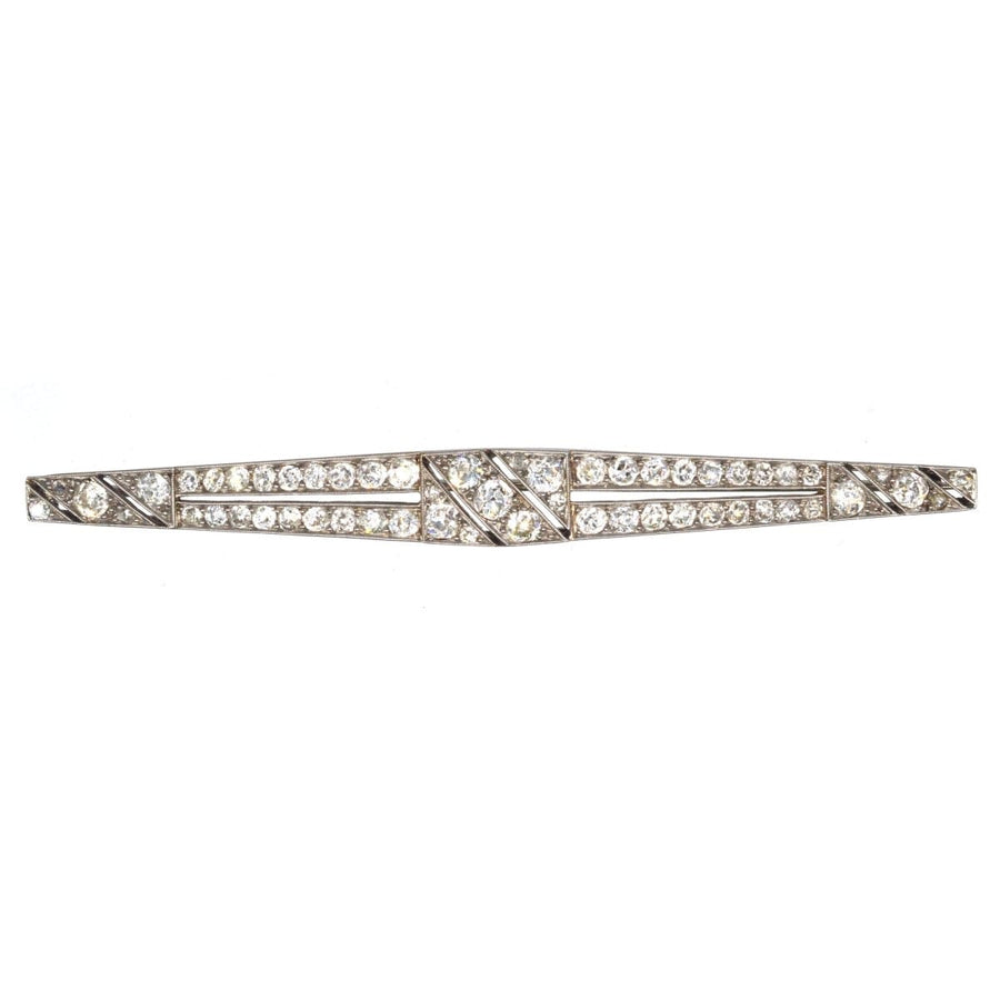 Large Art Deco platinum diamond bar brooch with intricate geometric design and over four carats of sparkling diamonds.