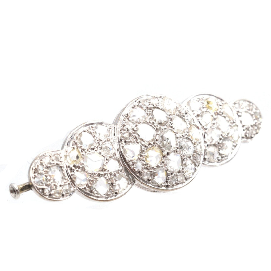 Art Deco rose cut diamond brooch with five circular sections, featuring approximately 5 carats of sparkling diamonds.