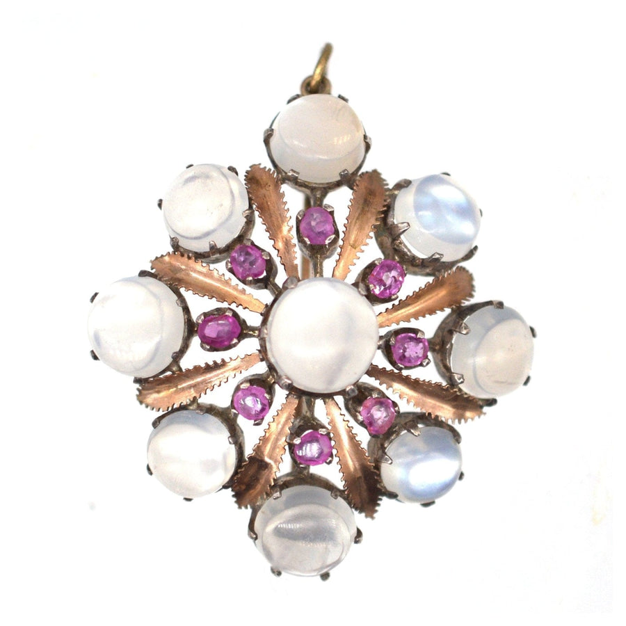Large Arts & Crafts brooch pendant in silver and 9ct gold, set with moonstones and natural rubies, dating from 1910.