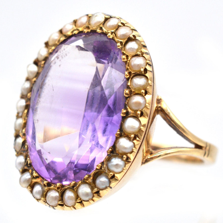 Large Edwardian 15ct gold cocktail ring featuring an amethyst and natural split pearls.