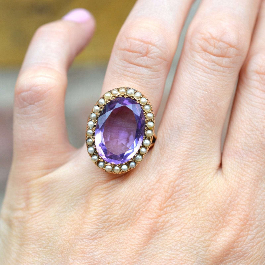 Large Edwardian 15ct gold ring with oval amethyst and natural seed pearls, circa 1900s.