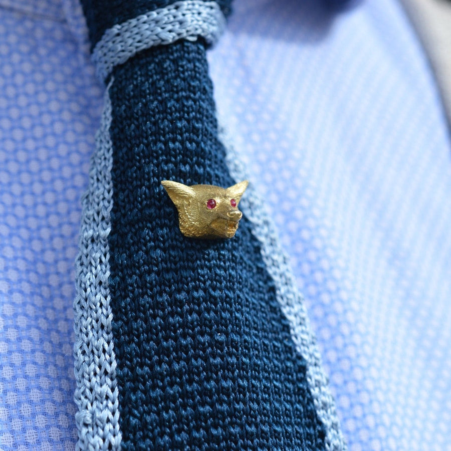 Large Edwardian 18ct gold fox tie pin with ruby eyes, perfectly styled on a textured blue tie.