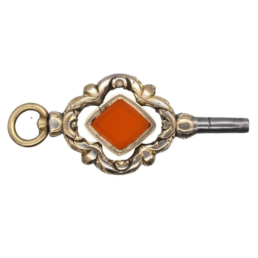 Large Regency gold watch key with diamond-shaped carnelian, circa 1820s-1830s, elegant decorative jewelry.