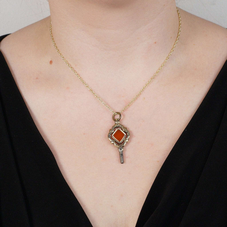Large Regency gold watch key pendant with diamond-shaped carnelian on a gold chain, circa 1820s-1830s.