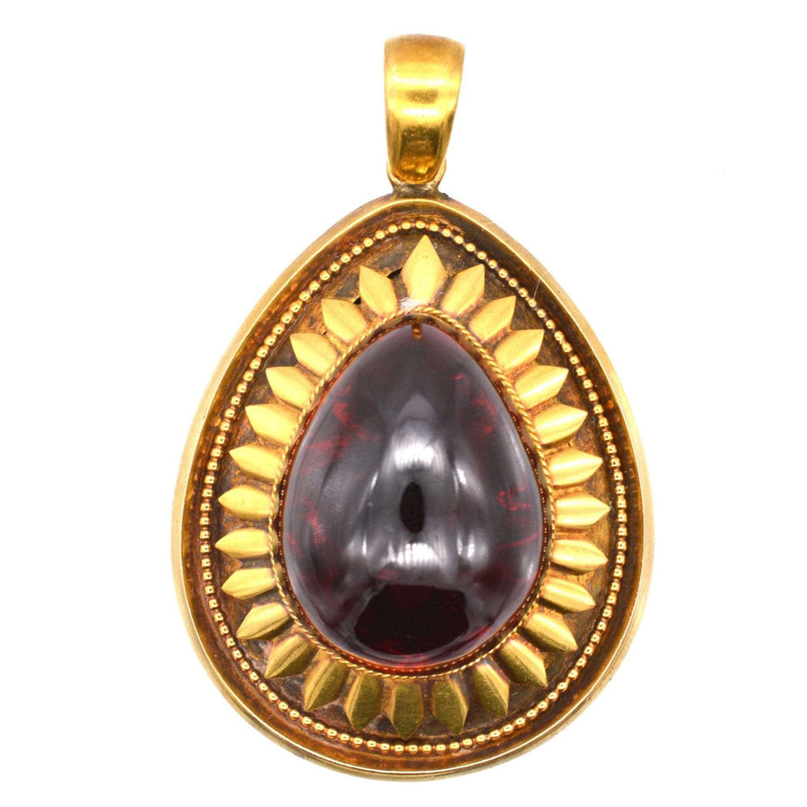Large Victorian 15ct Gold Cabochon Garnet Pendant with locket, circa 1860-1880, featuring detailed gold petal design.