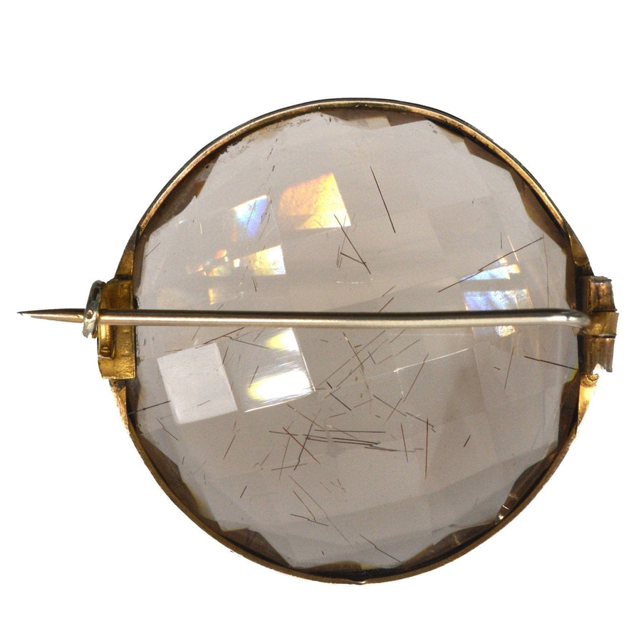 Large Victorian silver brooch featuring rutilated quartz in an exquisite design with sparkling inclusions.