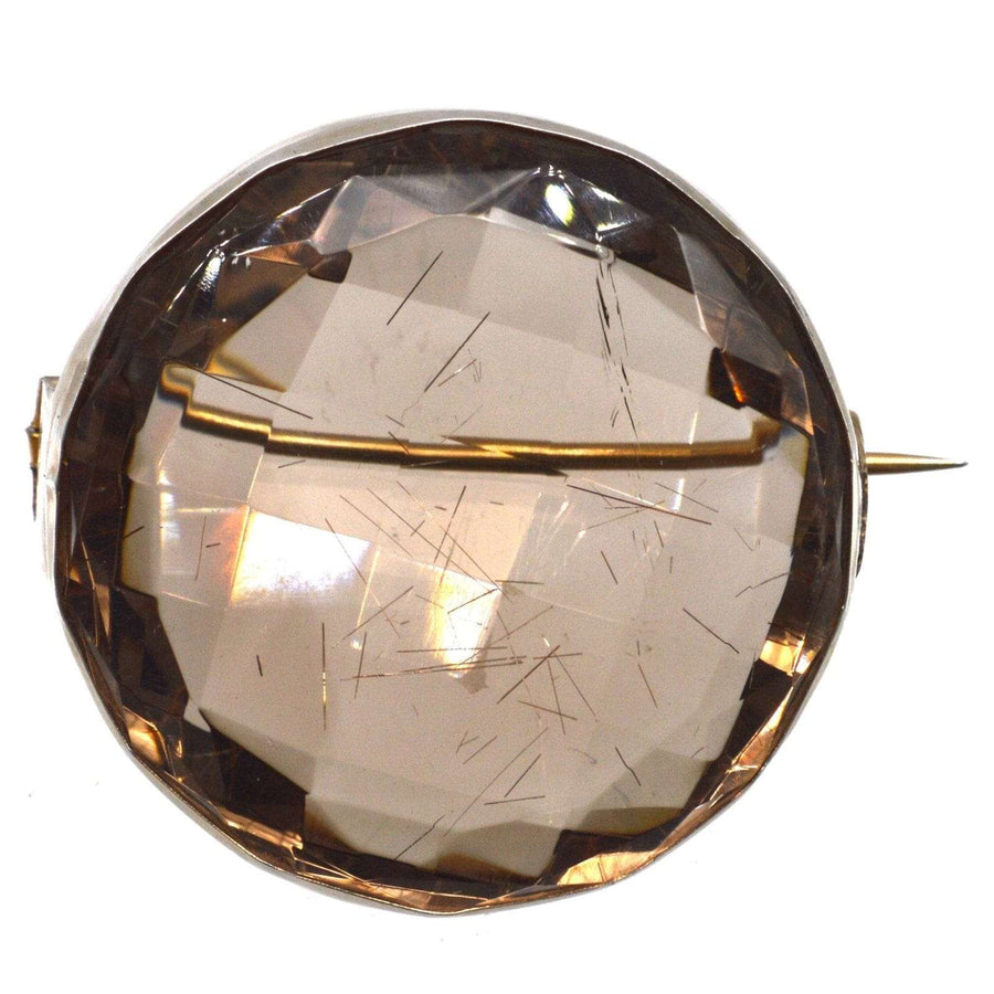 Large Victorian silver brooch featuring rutilated quartz in original case, showcasing unique angles and luster.