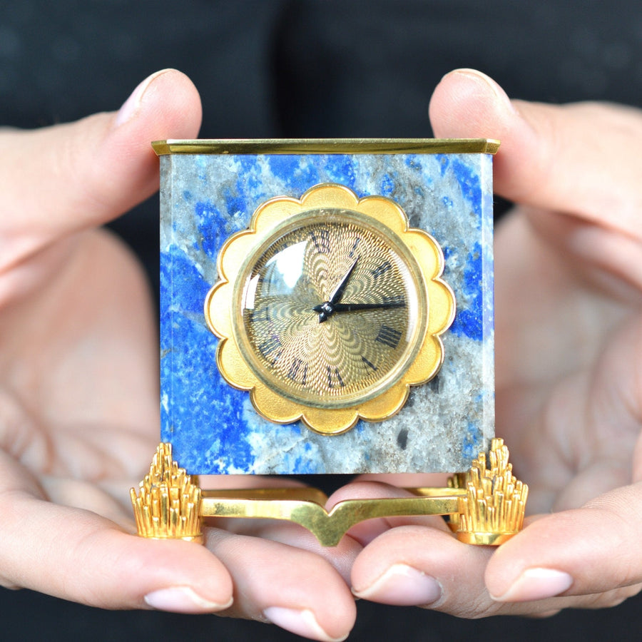18ct gold lapis lazuli mantlepiece clock by de Brysal, showcased in hands, vintage craftsmanship from the late 1960s.