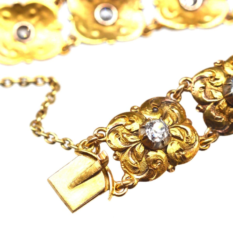 Late 19th century Art Nouveau gold bracelet featuring intricate foliage design and old mine cut diamond.