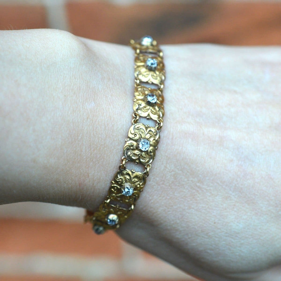 Art Nouveau 18ct gold bracelet featuring old mine cut diamonds, elegant foliage design, perfect for antique jewelry collections.