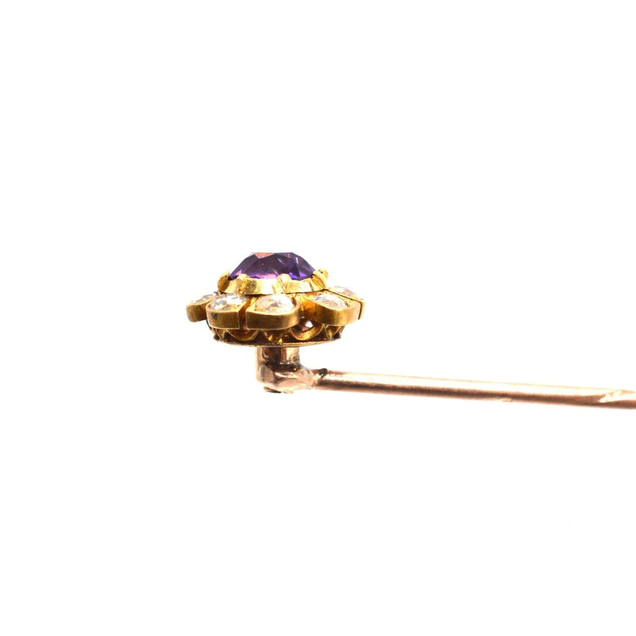 Late Victorian 15ct gold tie pin featuring an amethyst center and diamond cluster accents.