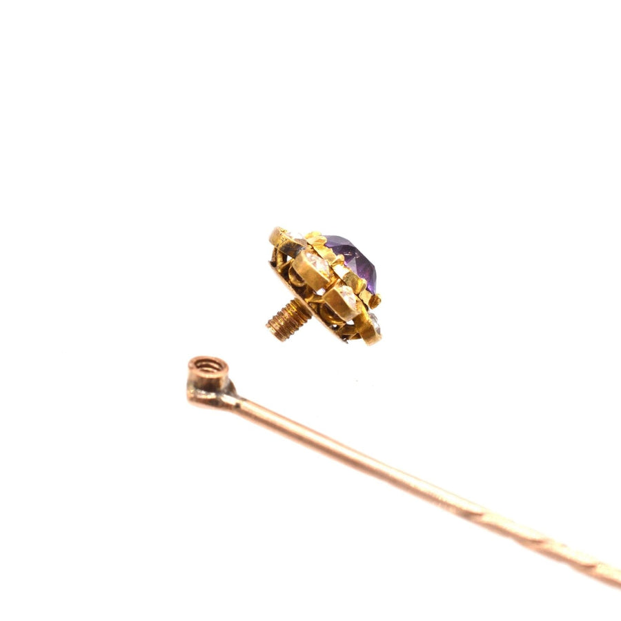 Late Victorian 15ct gold cluster tie pin featuring amethyst and diamond detail, showcasing elegance and craftsmanship.