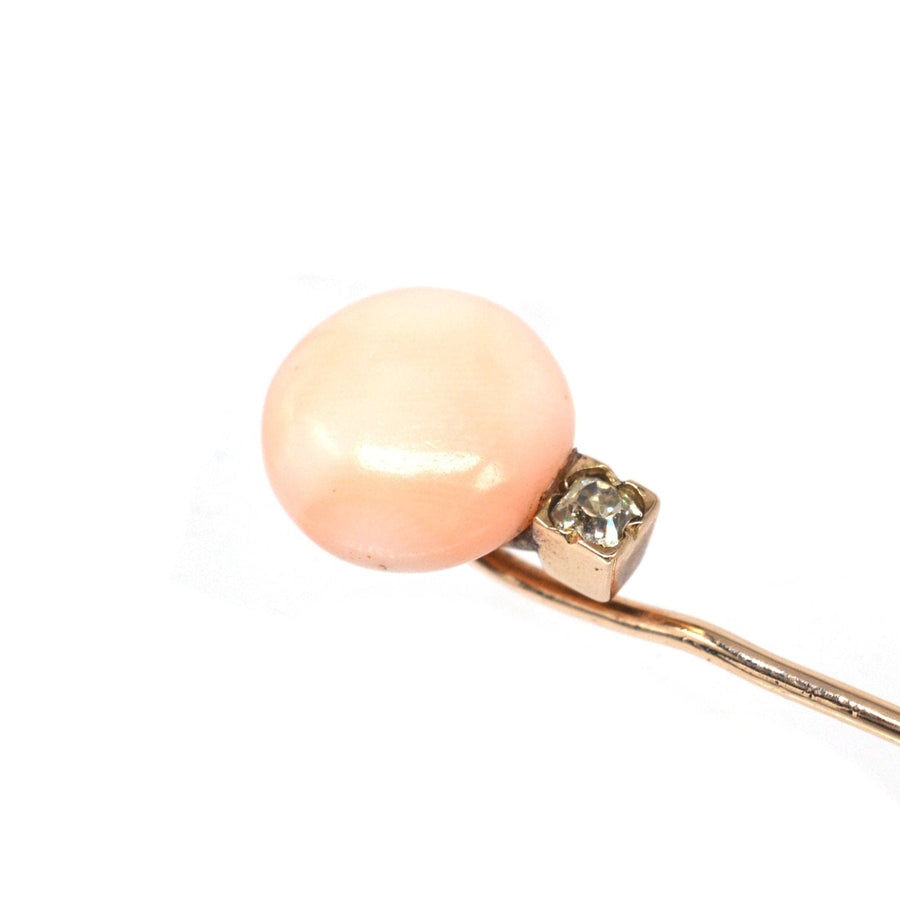 Late Victorian 15ct gold tie pin featuring Angel Skin Coral and an old mine cut diamond accent.