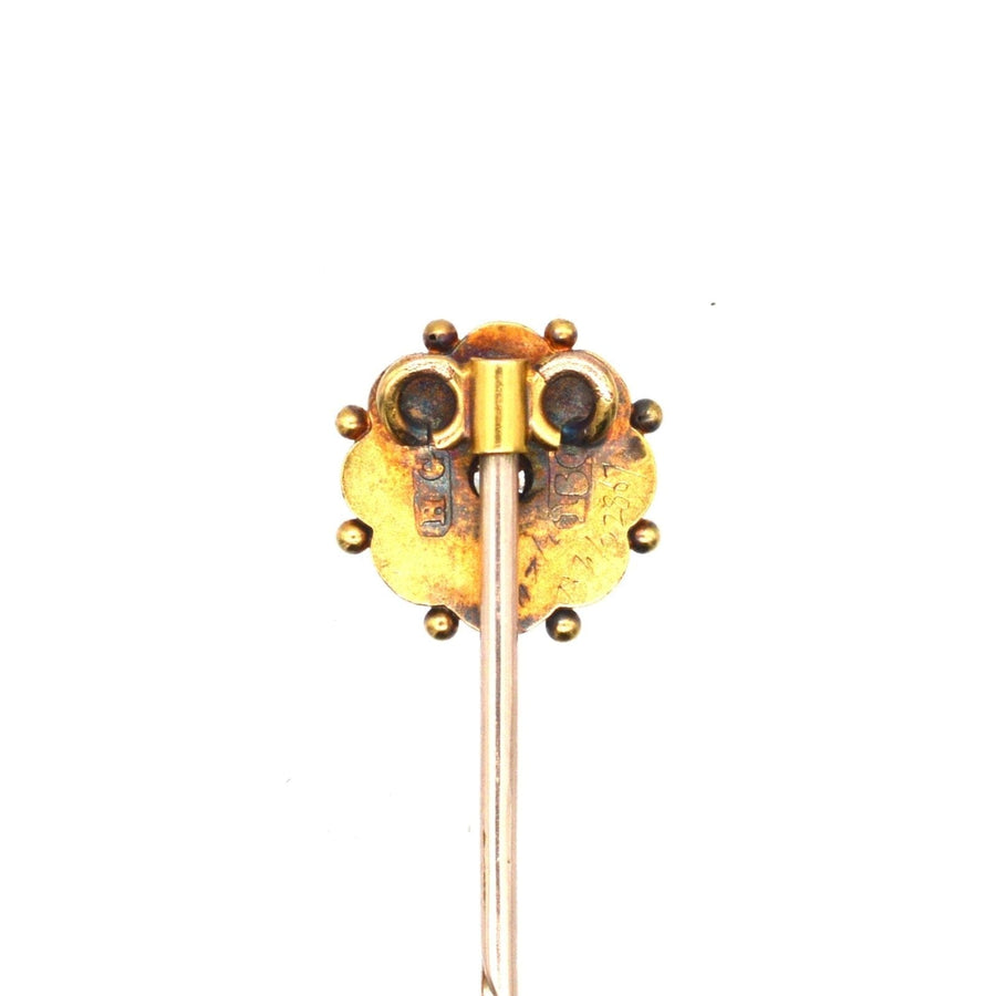 Late Victorian 15ct gold diamond flower tie pin with intricate design and golden orbs.