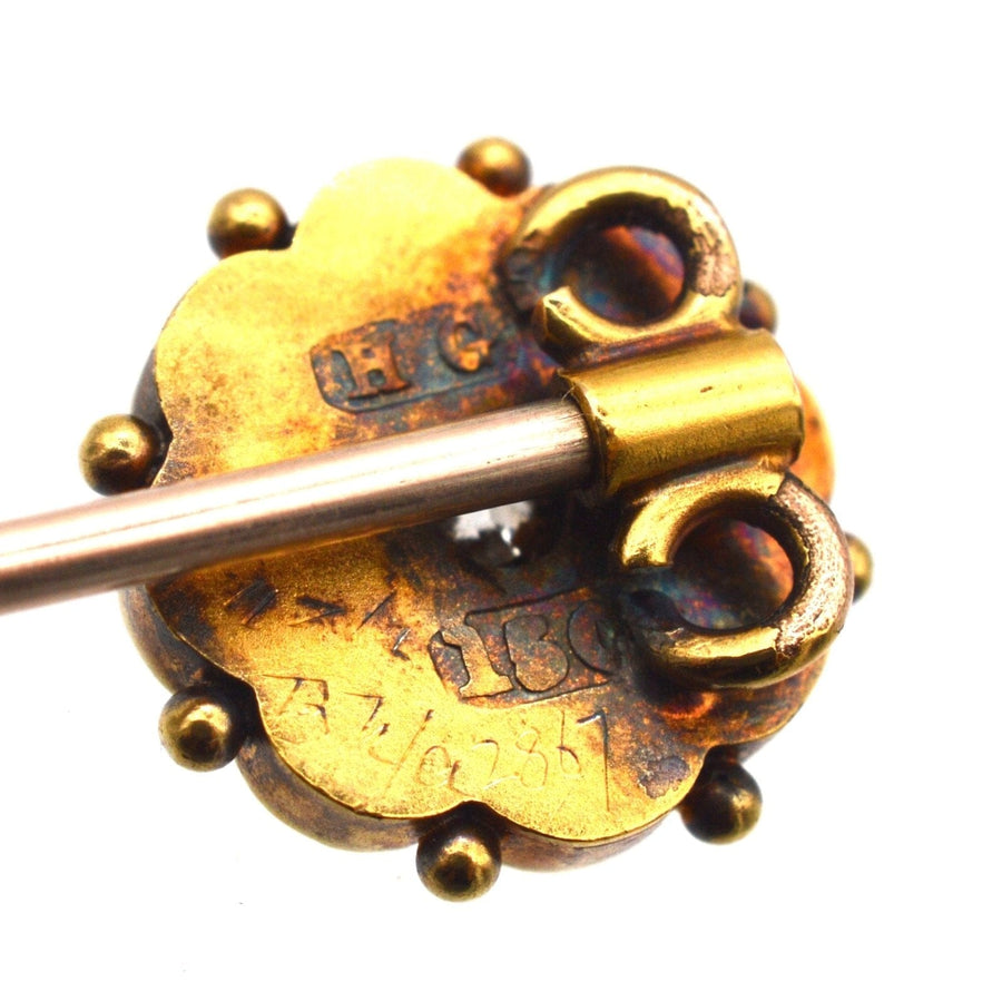 Vintage tie pin in 15ct gold featuring a flower design with a diamond centerpiece and detailed craftsmanship.