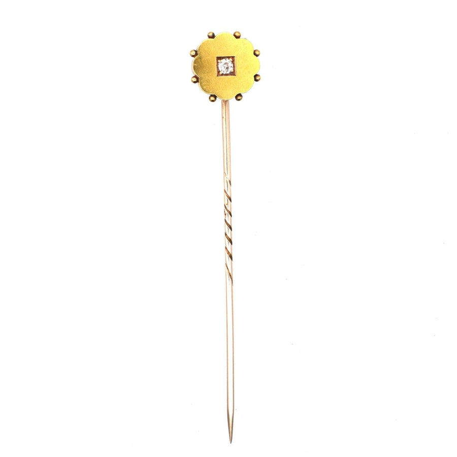 Late Victorian 15ct gold diamond flower tie pin with elegant floral design and square diamond center.