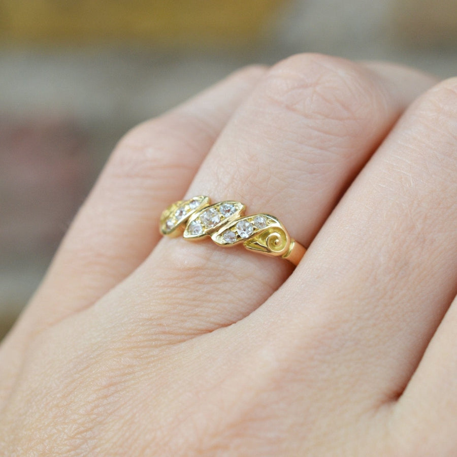 Late Victorian 18ct gold triple rope twist ring with old mine cut diamonds sparkling.