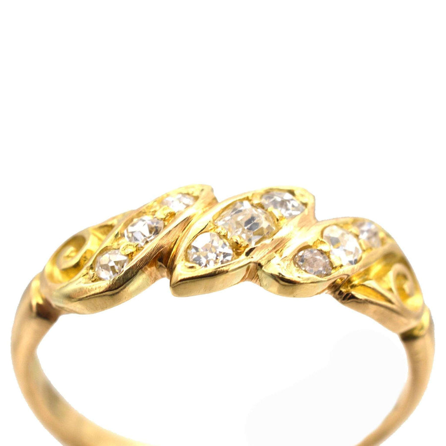 Late Victorian 18ct gold ring with old mine cut diamonds in rope twist design by Harrison & Sons.