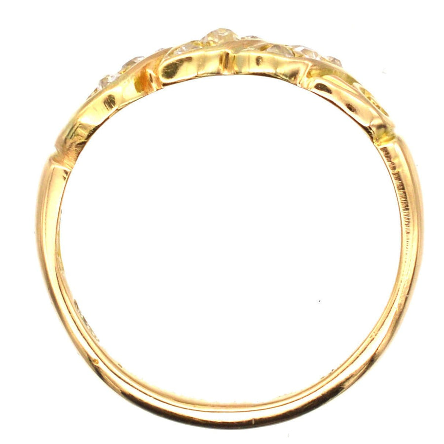 Late Victorian 18ct gold ring with old mine cut diamonds in a rope twist design.