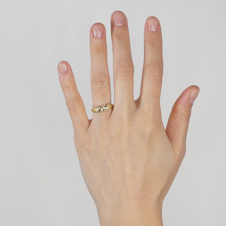 18ct gold late Victorian ring with old mine cut diamonds, showcasing a unique triple rope twist design on hand.