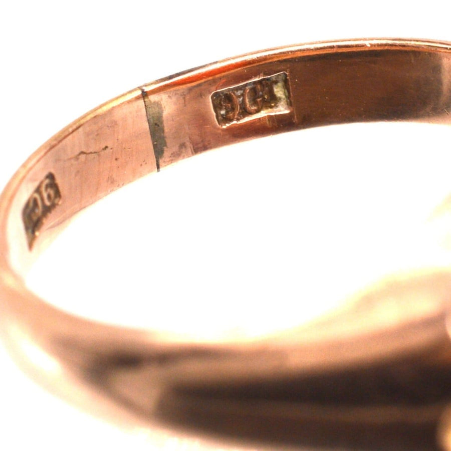 Close-up of the hallmark on a Late Victorian 9ct gold sardonyx signet ring, highlighting authenticity.