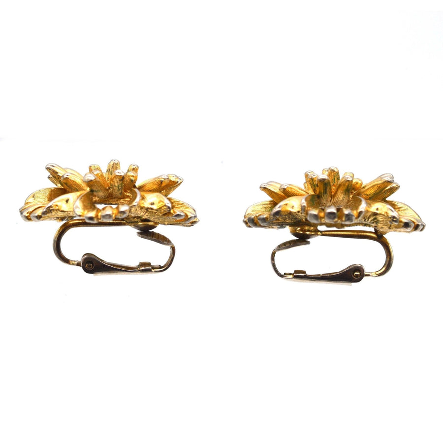 Vintage Marcel Boucher 1960s gilt metal clip-on earrings featuring a floral design and comfortable fit.