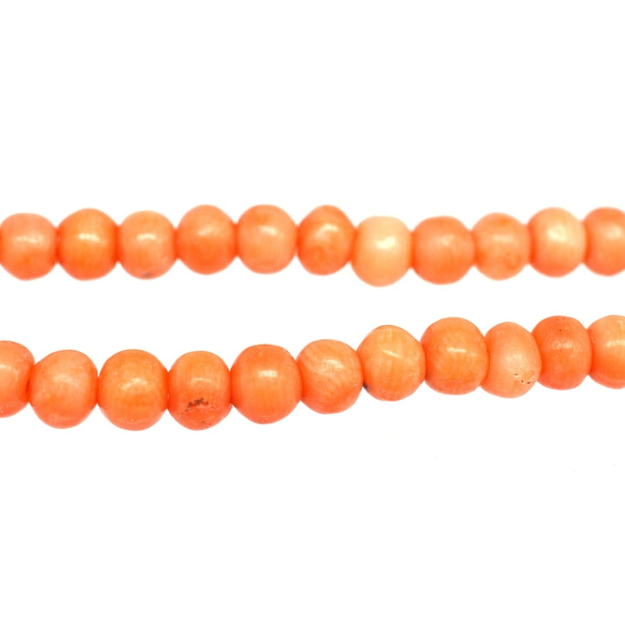 Mid 19th century salmon coral bead necklace featuring secure gold clasp, symbolizing healing and strength.