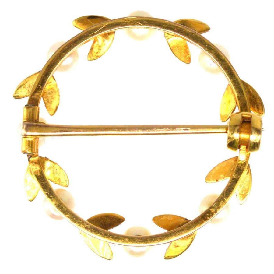 Mid 20th century gold and cultured pearl laurel wreath brooch, symbolizing triumph and joy, perfect for any lapel.