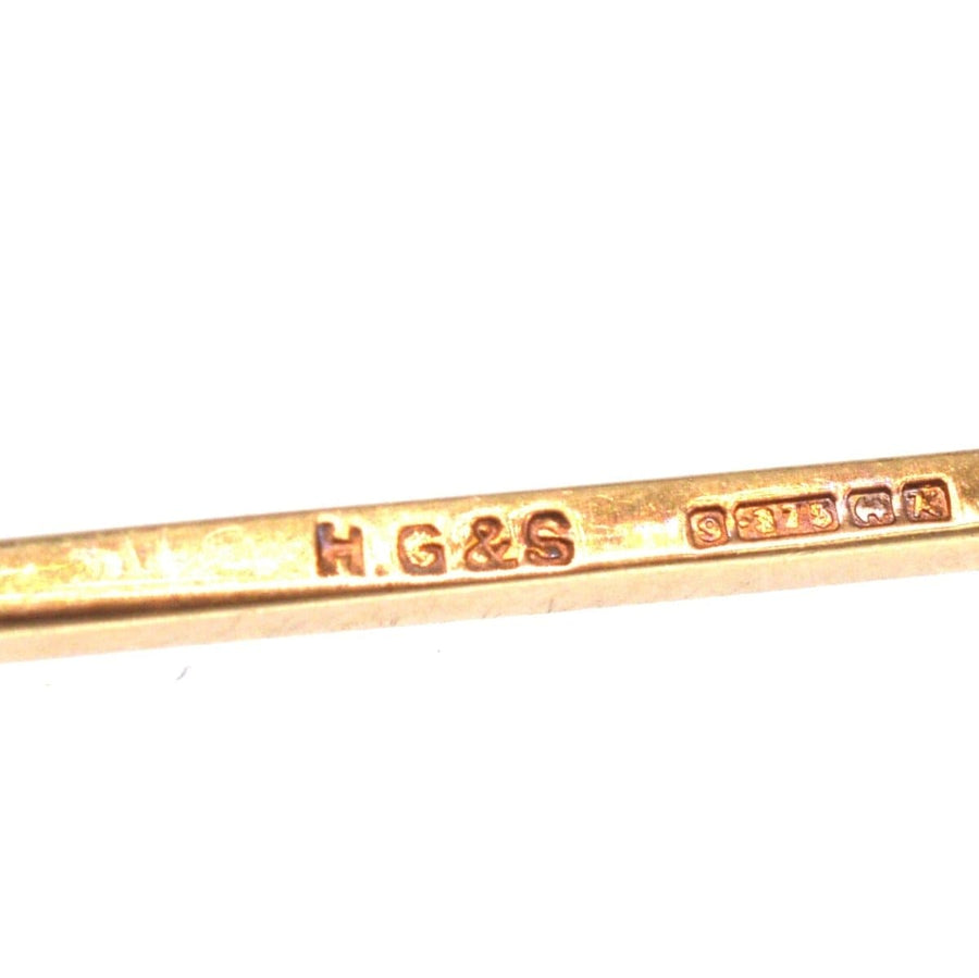 Close-up of the hallmark on a Mid Century 9ct Gold Flat Bar Brooch by Henry Griffith & Sons Ltd.
