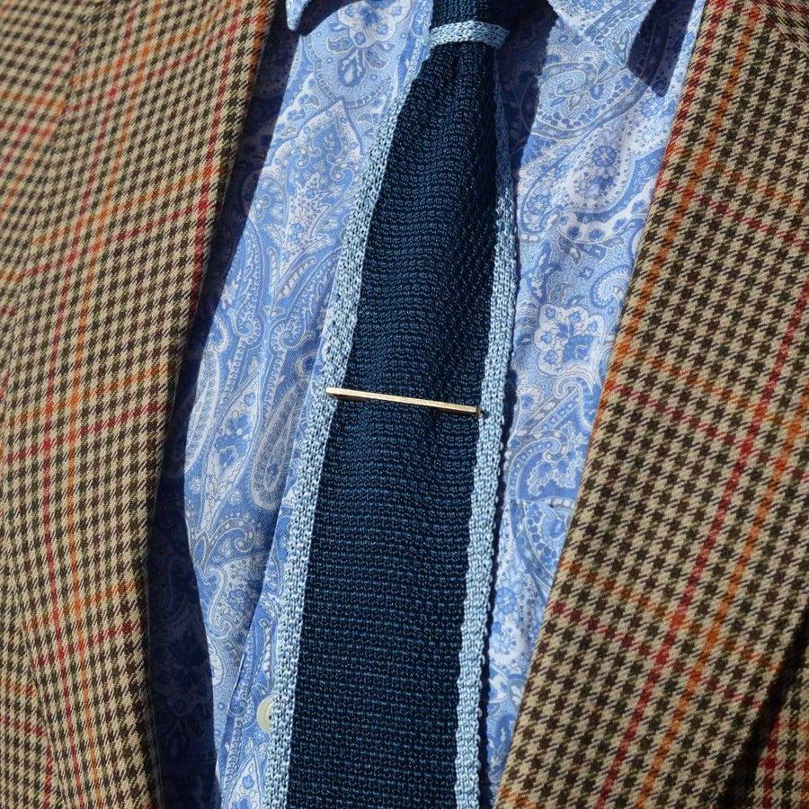 Mid Century 9ct Gold Flat Bar Brooch by Henry Griffith & Sons Ltd worn on a blue tie with plaid blazer.