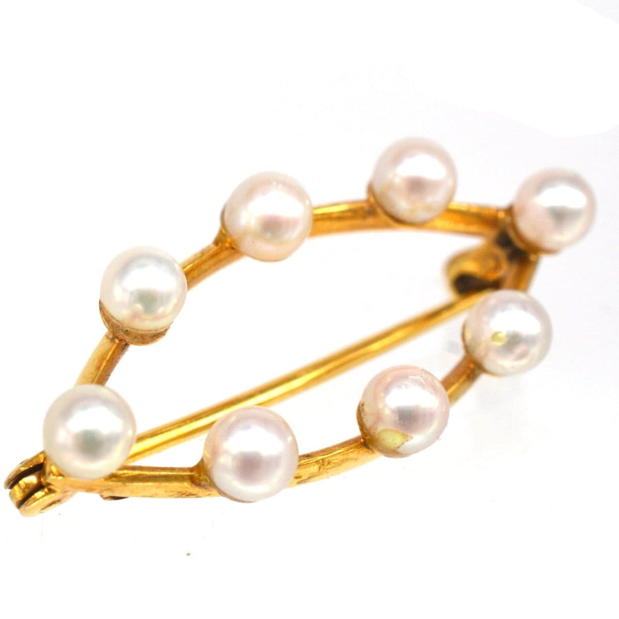 Mid century 9ct gold marquise bar brooch featuring eight cultured pearls, showcasing timeless modern jewellery design.