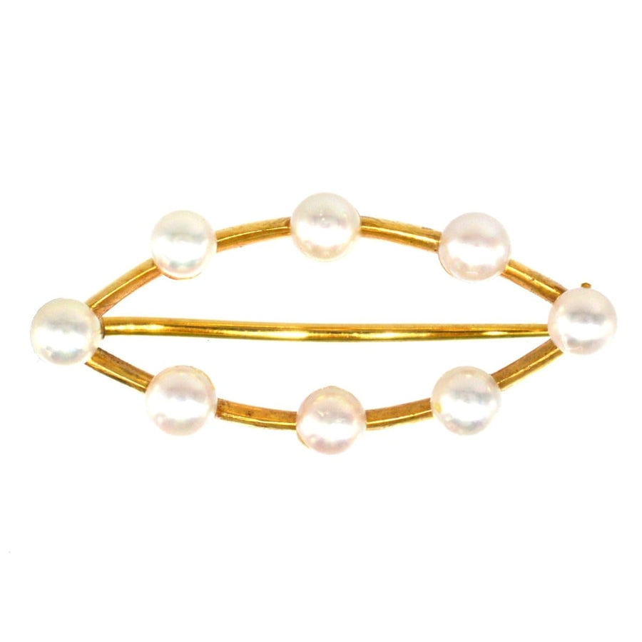 Mid Century 9ct gold marquise bar brooch featuring eight cultured pearls in a timeless design.