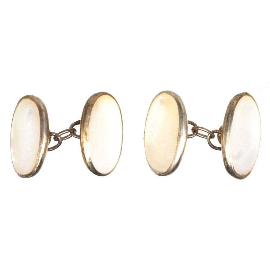 Mid Century German silver cufflinks with mother of pearl oval design, adding elegance to any shirt.