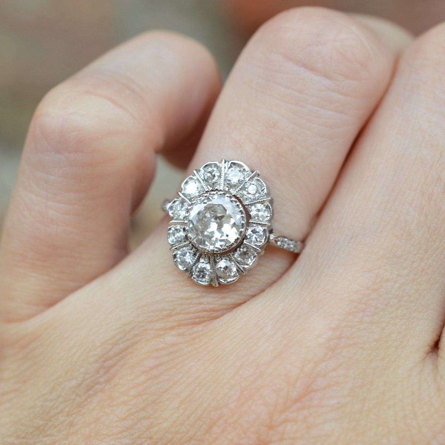 Mid Century 18ct white gold oval diamond cluster ring, featuring a stunning 1 carat center diamond. Perfect engagement ring.